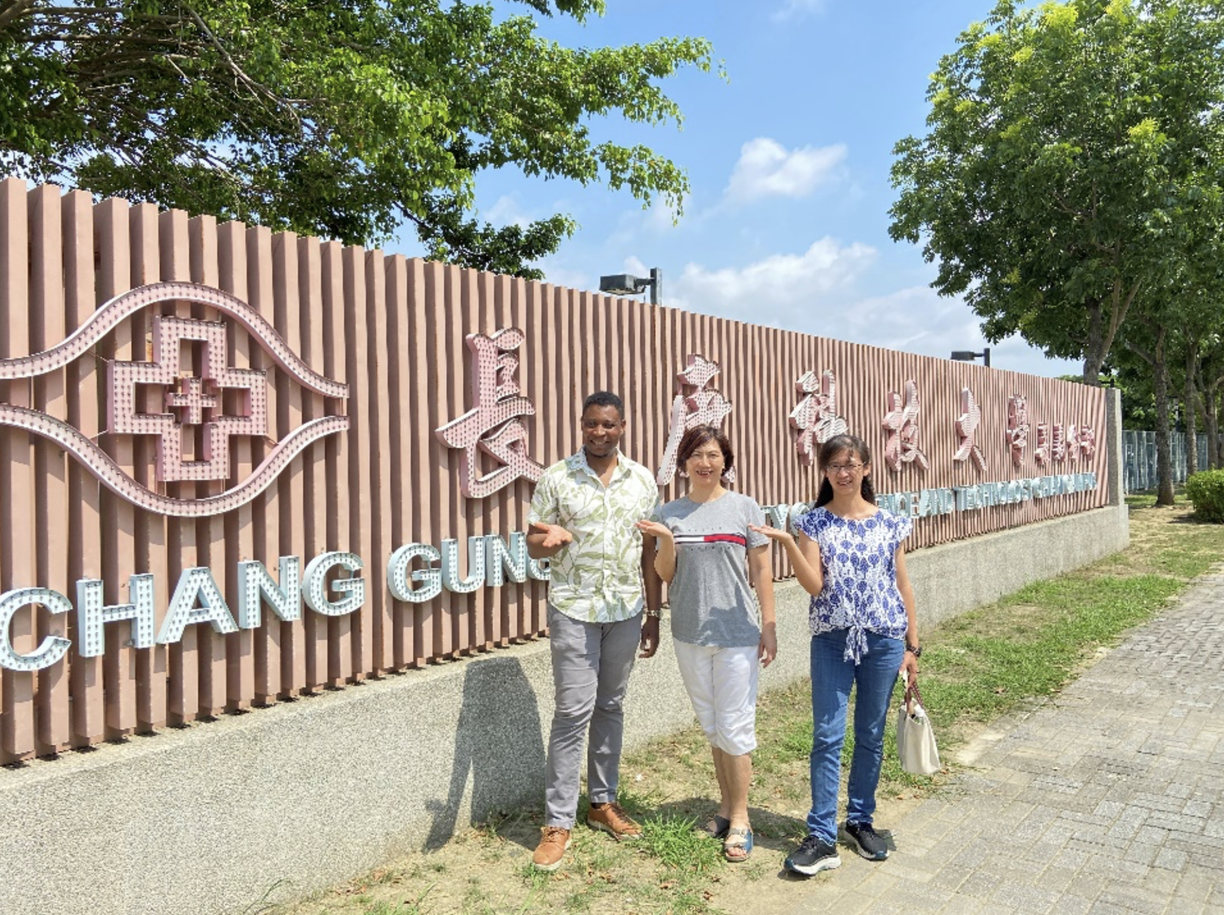 people in front of a sign