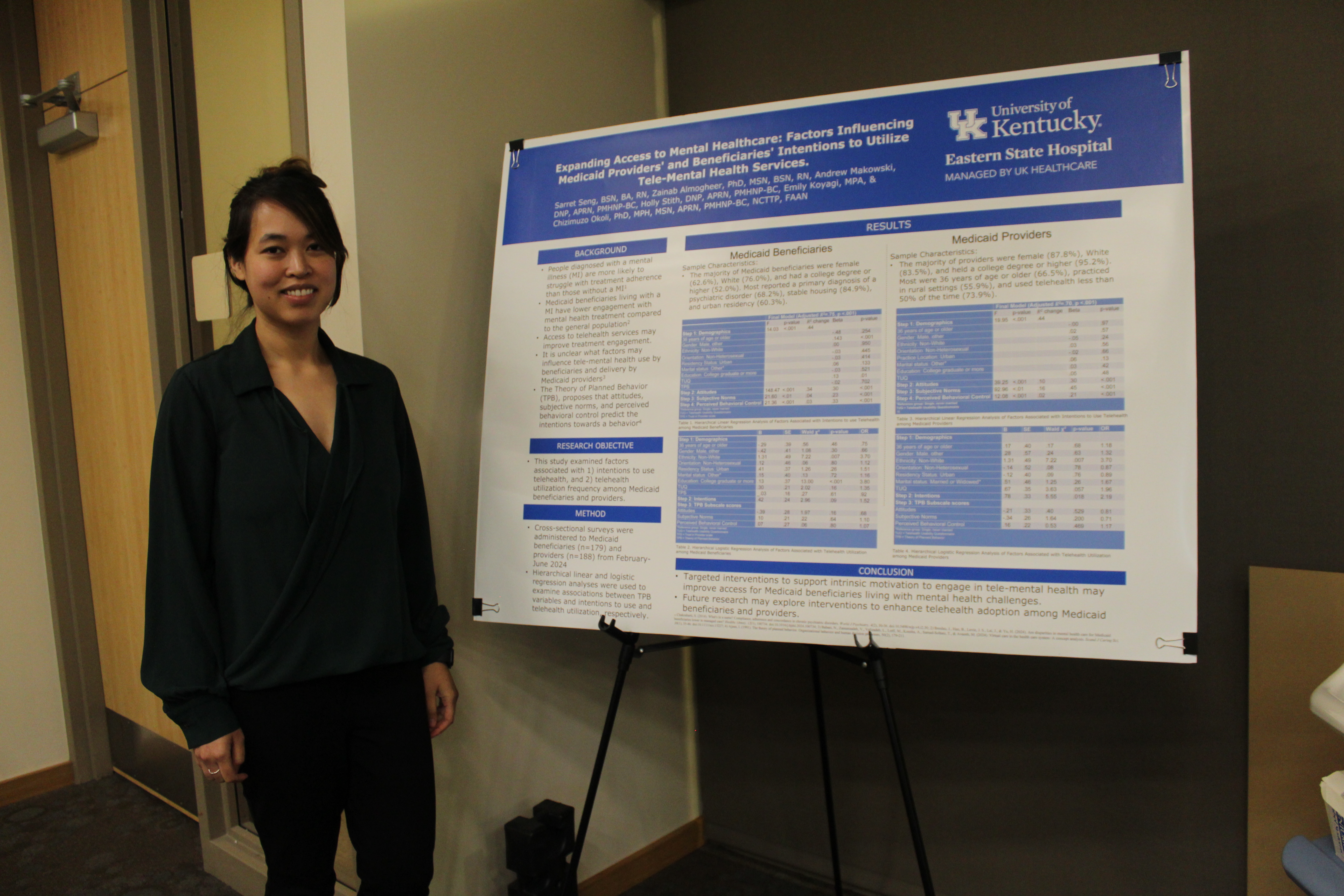 sarret with poster