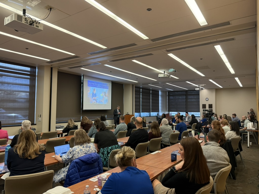 Photo of a crowd of 70 in a full room during Allen Brenzel's talk