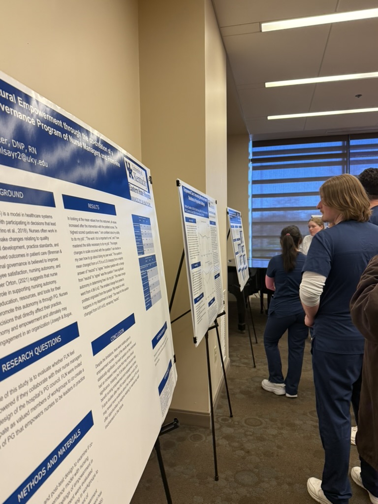 people viewing posters
