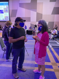 Dr. Walmsley connecting with a Curiosity Fair attendee.