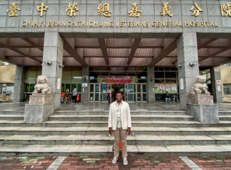 man in front of landmark