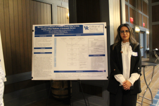Dr. Zainab Almogheer with her poster