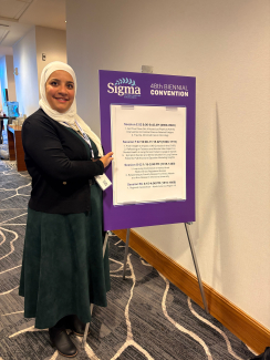person next to poster