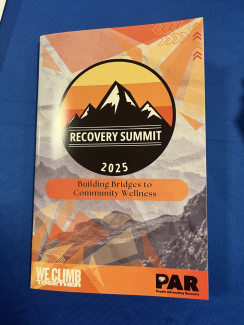 event program with orange and black theme