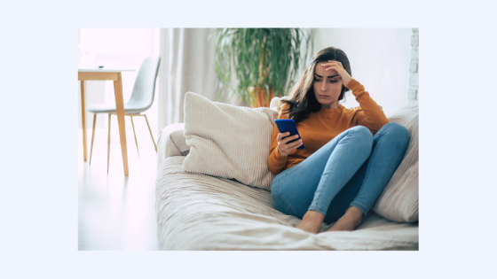 girl looking at her phone