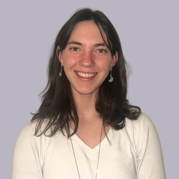 young white woman in white shirt on gray background