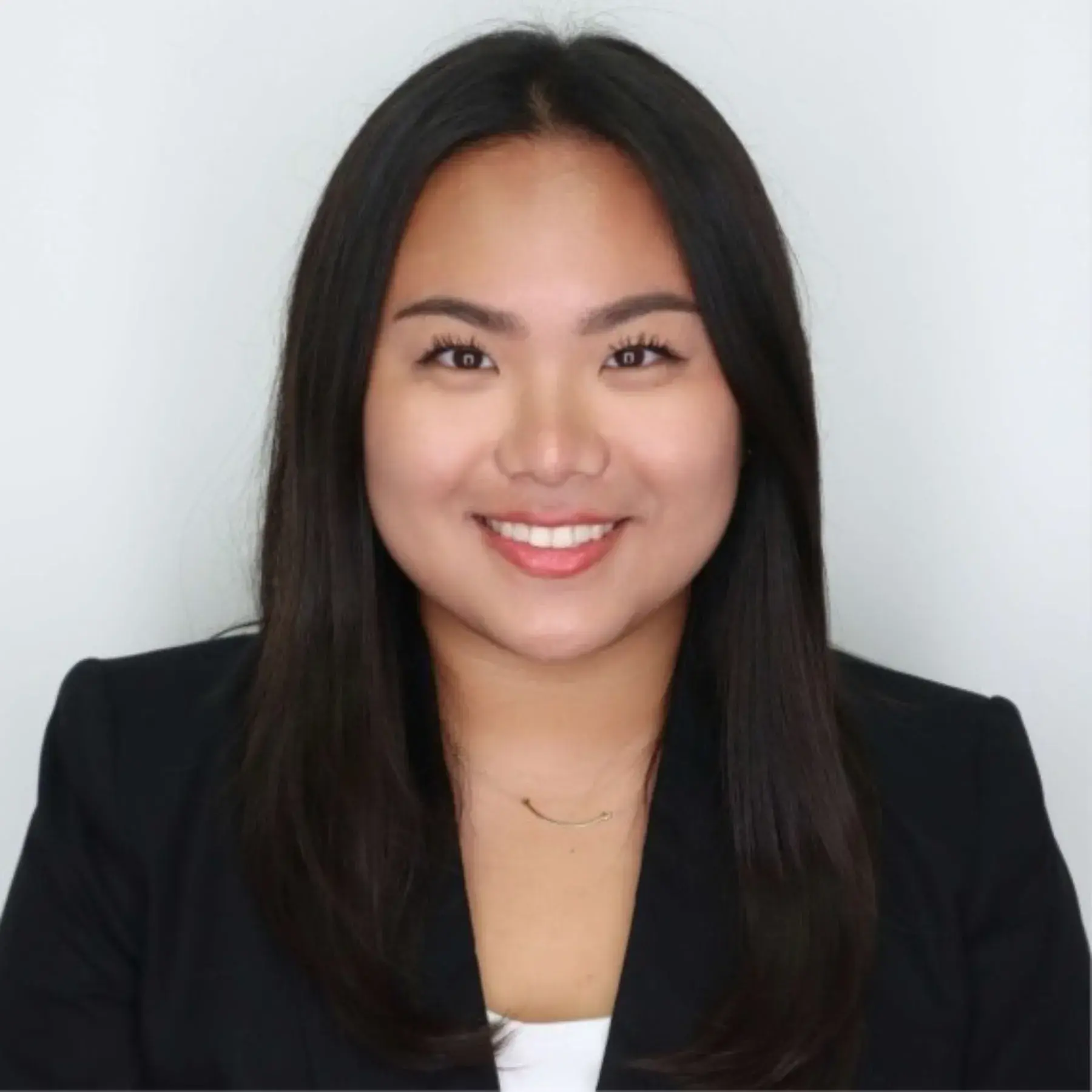 Female of asian descent in professional black jacket